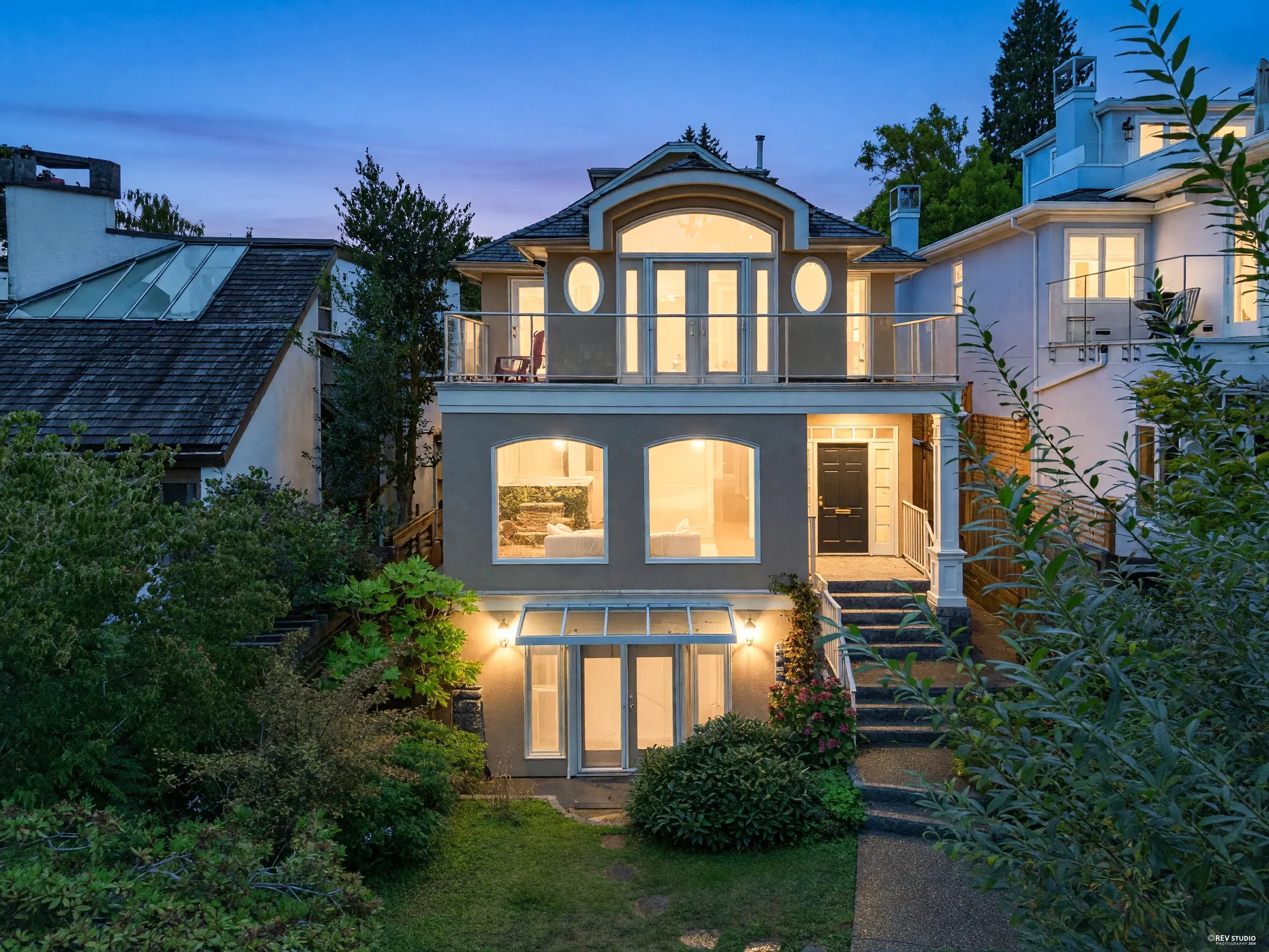 The rear of the house from the air at dusk