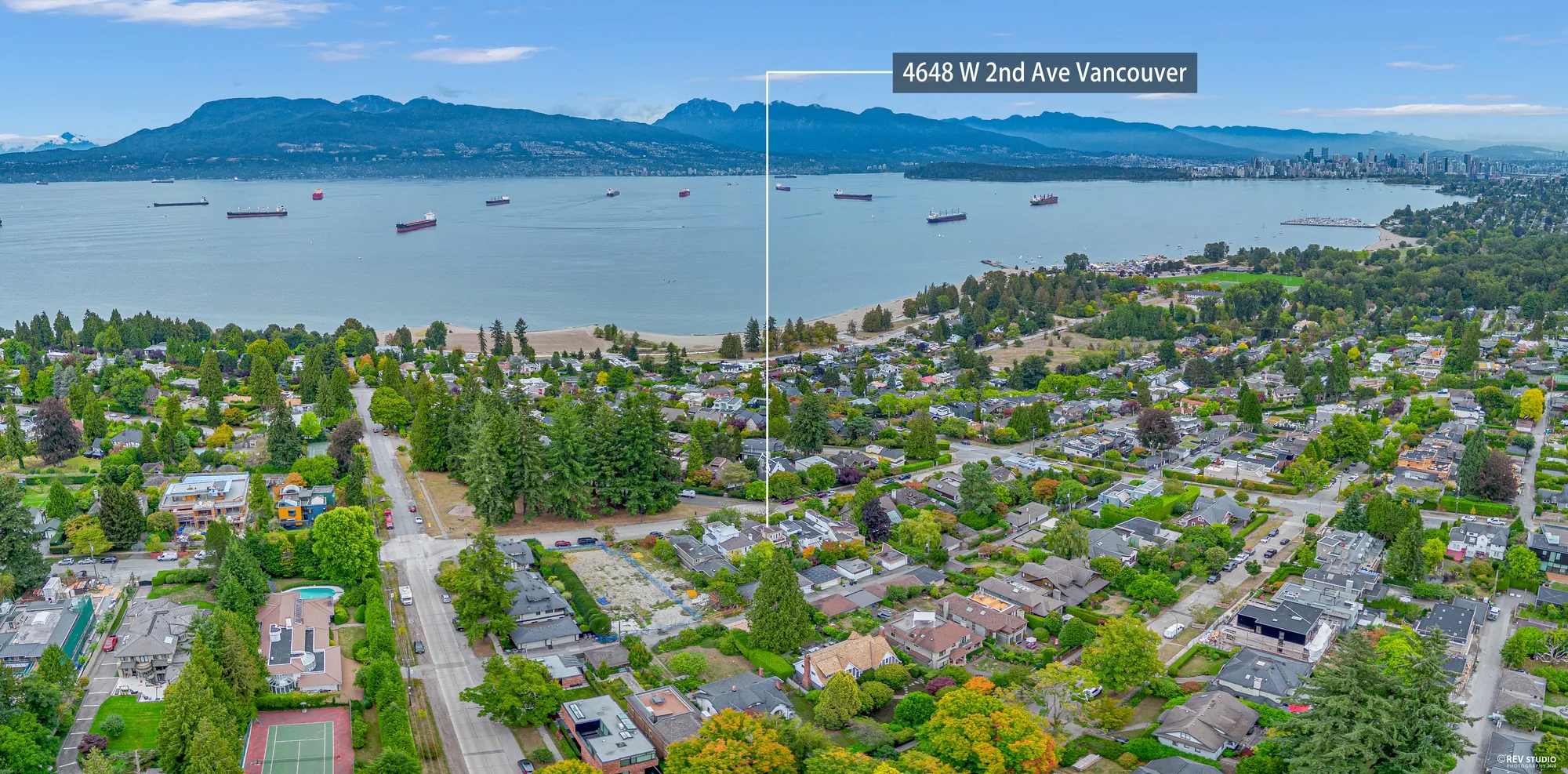An aerial panorama with the property marked, looking north to English Bay