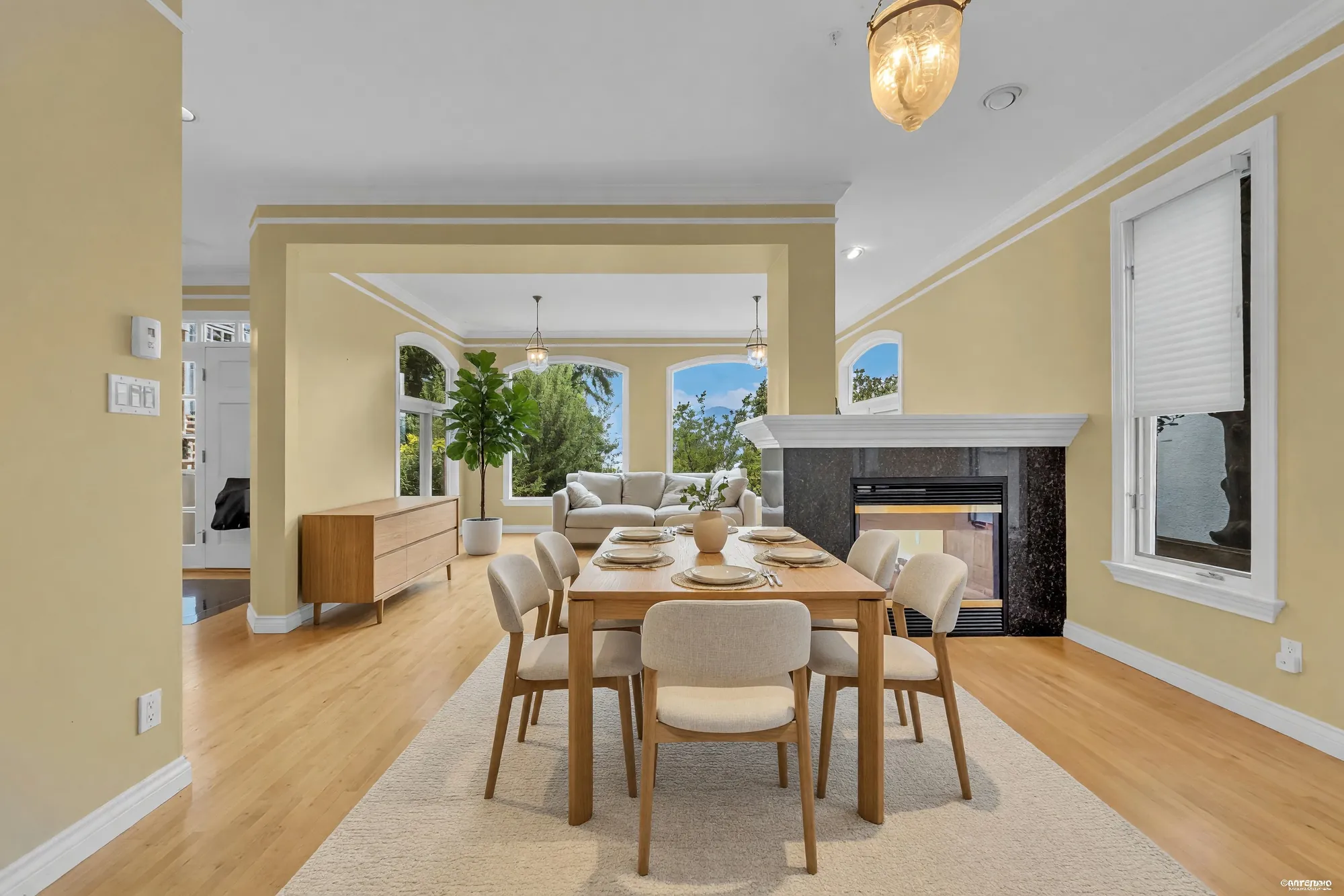 The dining room shown with a digitally added table, chairs and sideboard