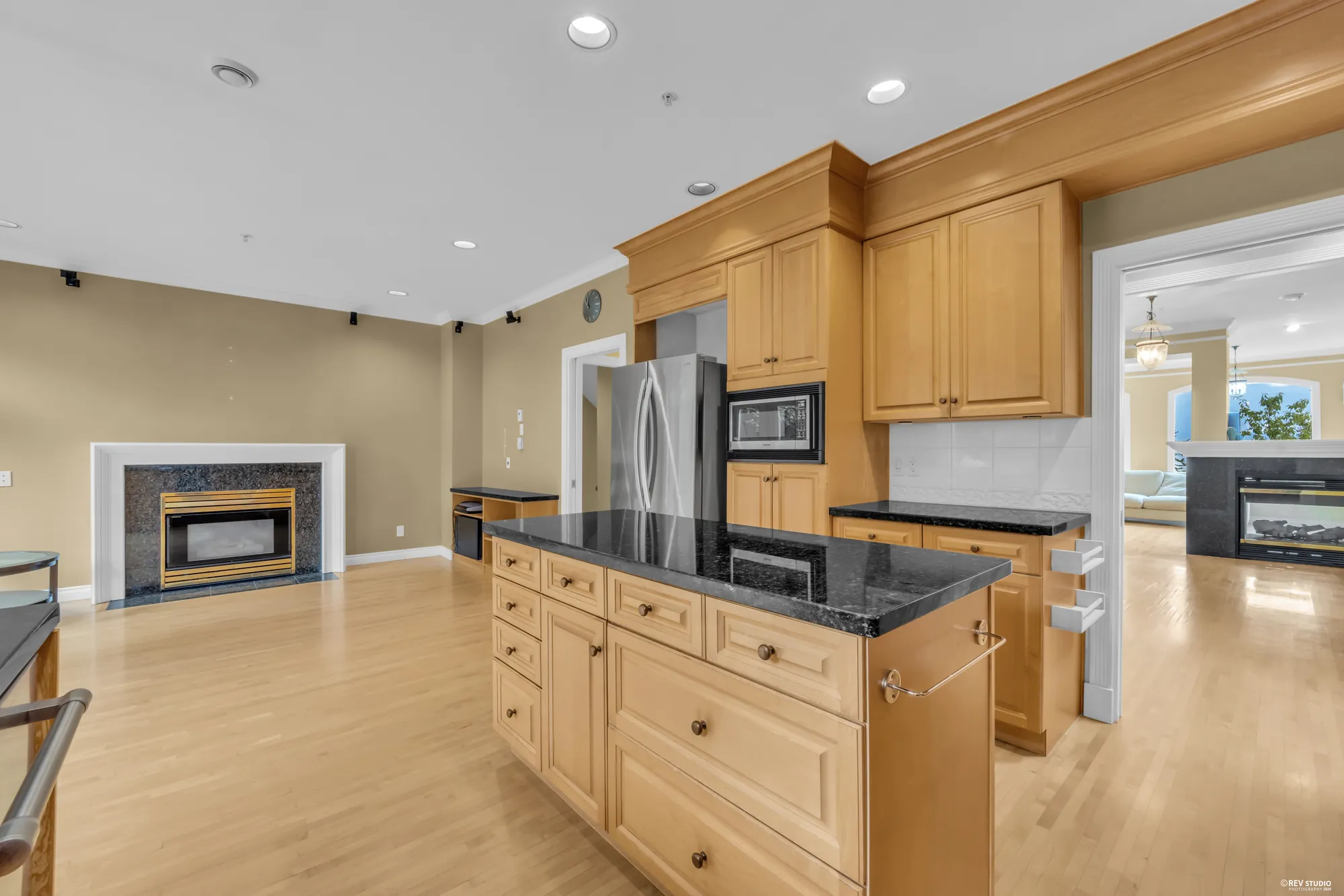 The kitchen island with the family room beyond