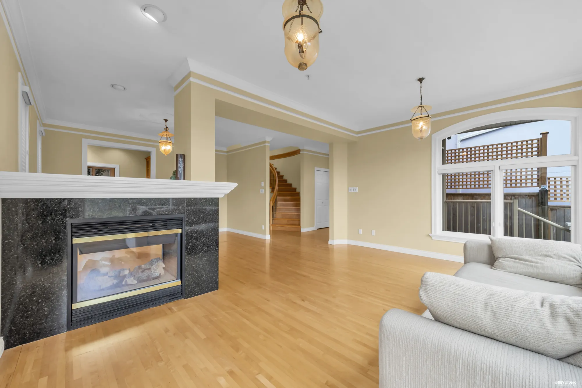 The stone-faced fireplace between two rooms