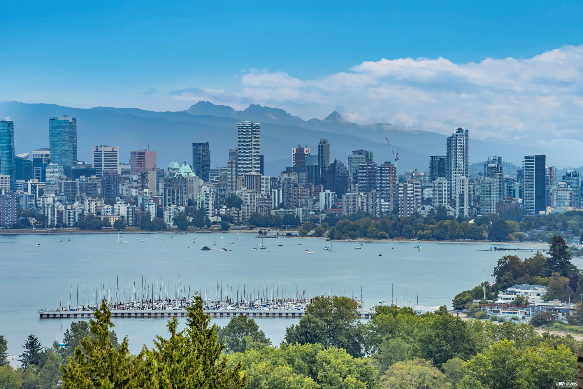 Downtown Vancouver towers and a marina seen across the water from the property